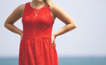 red-dress-hands-on-hips-lake-michigan-chicago